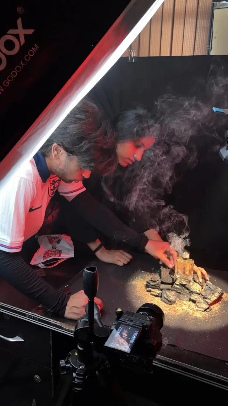 On-set practical atmospheric smoke effects and Godox softbox lighting for commercial reel