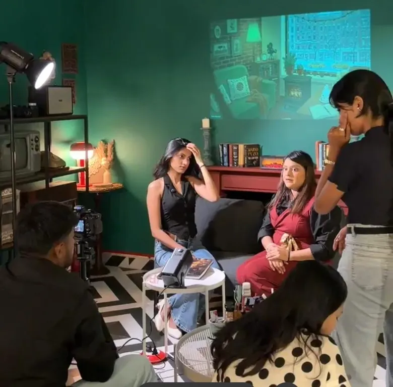 Tanisha directing live set video production with talent, crew, and multi-camera setup